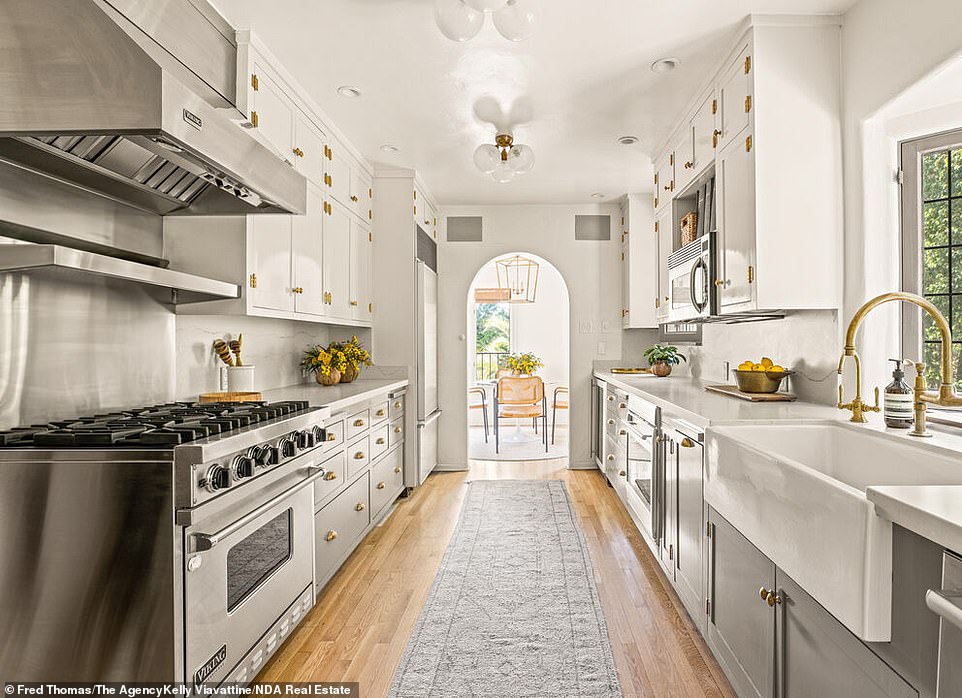 Kitchen: Gourmet kitchen with quartz marble countertops, and custom cabinetry with Italian hardware