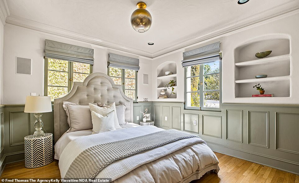 Bedroom: This floor also features an ensuite room with original wainscoting.