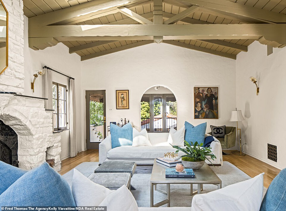 Ceilings: Hollywood Hills residence features oak floors, colorful mosaic tiles, wood-beamed ceilings and skylights